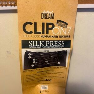 Natural dream 7 peice hair clips 
Black